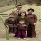 Ng Hung On pictured with his wife and children
